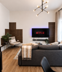 bromley-living-room-smart-tv-relaxing-stay Relax in the bright open-plan living area with a comfy sofa, Smart TV with Netflix, stylish décor and plenty of natural light.