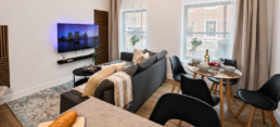 bromley-open-plan-living-dining-bright-stay Work-friendly bedroom in a Bromley one-bedroom flat with desk, soft bedding and calm guest-ready styling.
